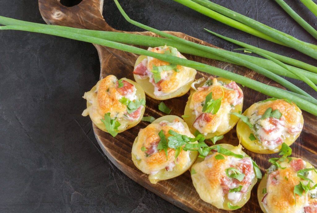 Hot baked stuffed potatoes with cheese