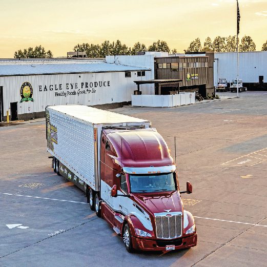 Eagle Eye Logistics truck in front of an Eagle Eye Produce warehouse