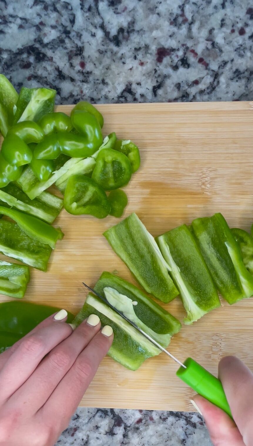 Chopping peppers on cutting board
