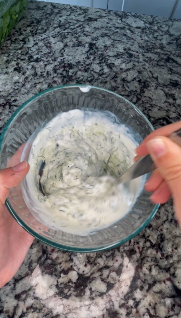 Mixing Tzatziki sauce ingredients together