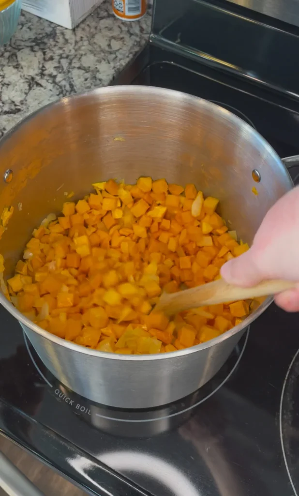 Stirring together squash and spice blend