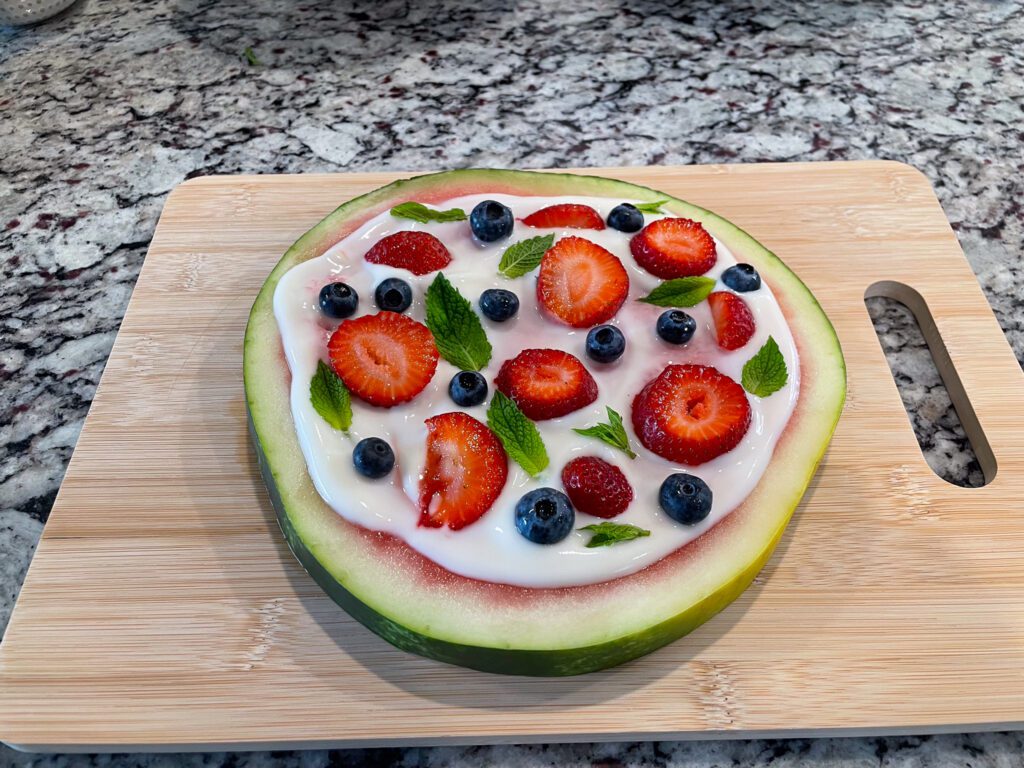 Watermelon dessert pizza before being cut into slices
