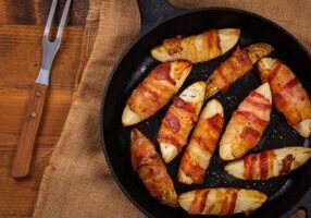 Bacon Wrapped Potatoes Wedges. Selective focus.