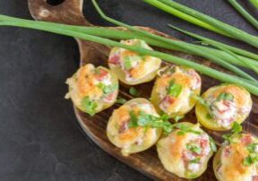 Hot baked stuffed potatoes with cheese